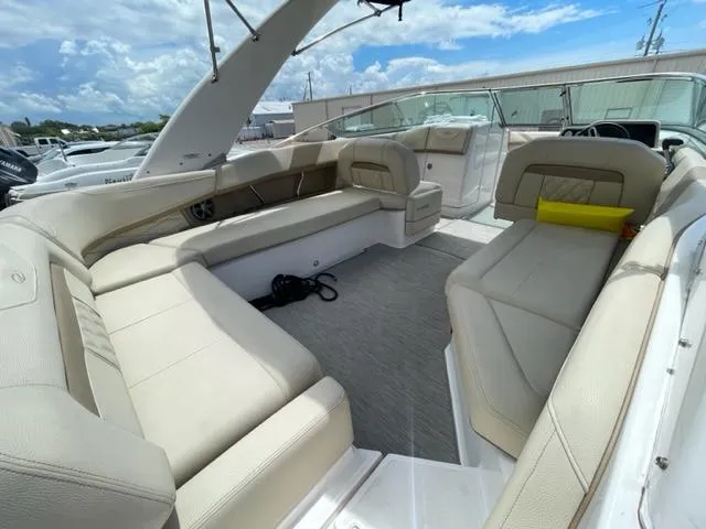 Slide: The Image of 2016 Regal 26 Fastdeck boat with spacious seating and modern interior design. - 6