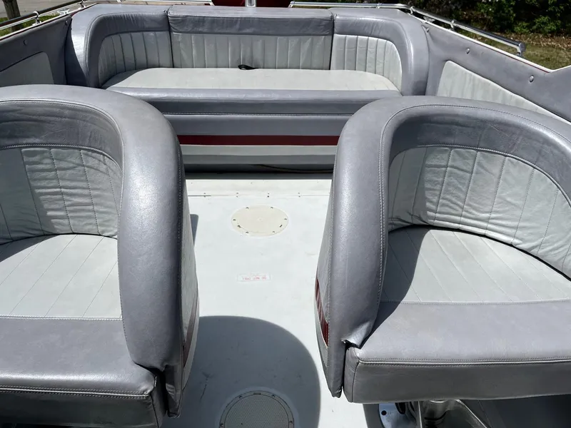 Slide: The Image of 1988 Boston Whaler Temptation 2200 boat interior with gray seating. - 13