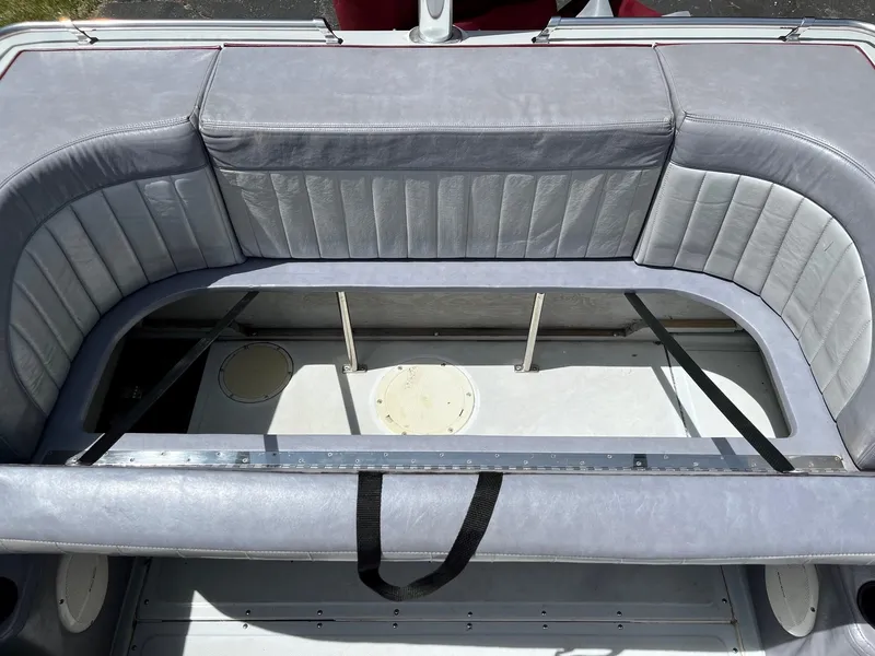 Slide: The Image of 1988 Boston Whaler Temptation 2200 boat interior seating area. - 14