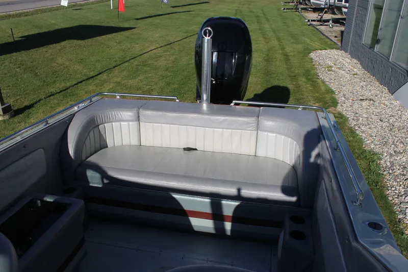 Slide: The Image of 1988 Boston Whaler Temptation 2200 boat interior with rear seating and outboard motor. - 15