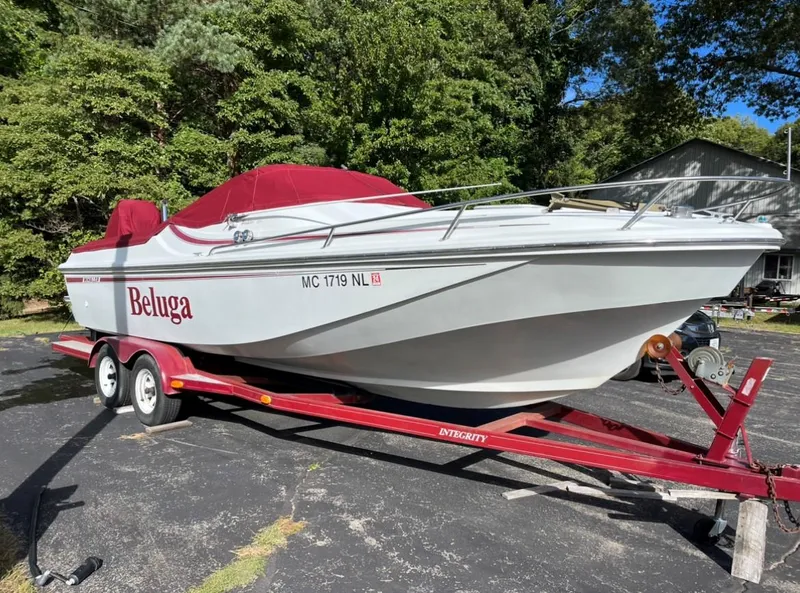 Slide: The Image of 1988 Boston Whaler Temptation 2200 boat on a red trailer, named Beluga. - 16