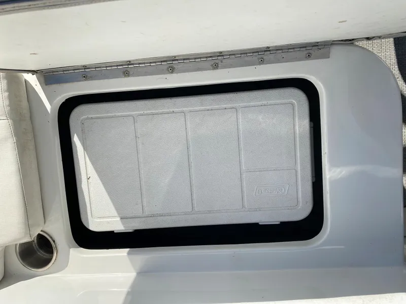 Slide: The Image of 2019 Caravelle 19 EBo Bowrider storage compartment with lid. - 11