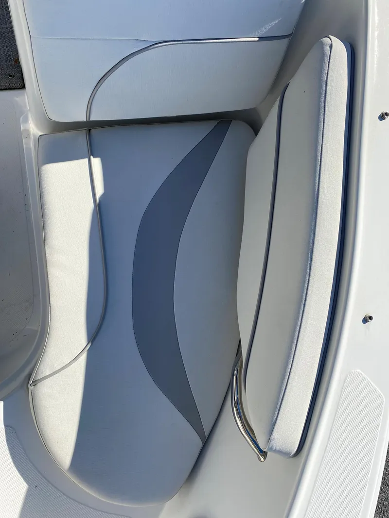 Slide: The Image of 2019 Caravelle 19 EBo Bowrider interior seating, white and gray upholstery. - 13