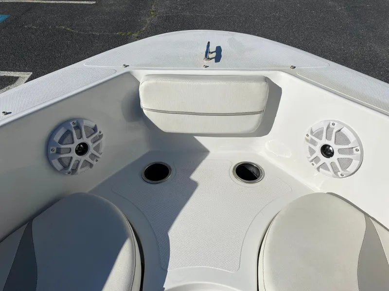 Slide: The Image of 2019 Caravelle 19 EBo Bowrider boat interior with speakers and seating. - 2