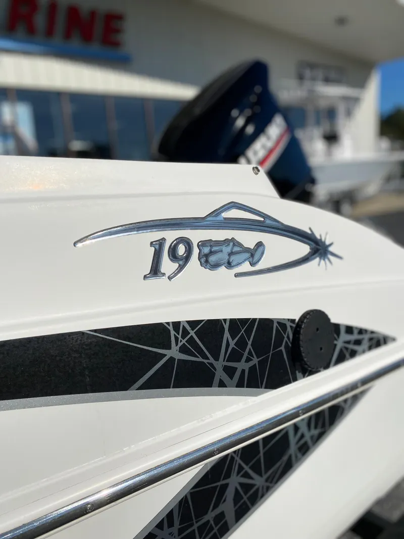 Slide: The Image of 2019 Caravelle 19 EBo Bowrider boat side view with logo. - 26