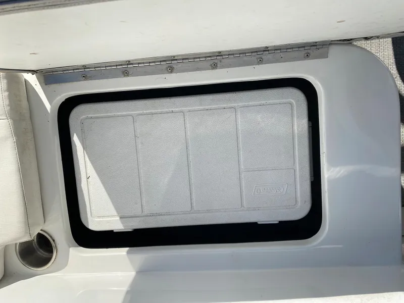 Slide: The Image of 2019 Caravelle 19 EBo Bowrider storage compartment with a closed hatch. - 29