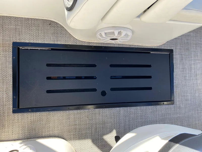Slide: The Image of 2019 Caravelle 19 EBo Bowrider boat interior with storage compartment. - 3