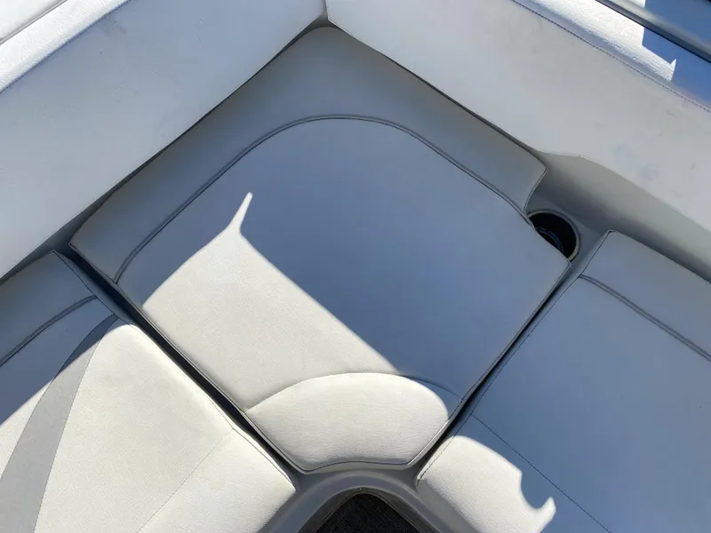 Slide: The Image of 2019 Caravelle 19 EBo Bowrider boat interior seating area. - 6