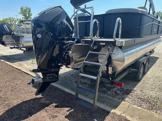 Slide: The Image of 2024 Barletta C24QC pontoon boat with Mercury outboard motor and boarding ladder. - 4