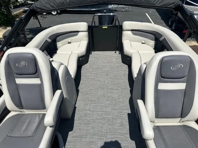 Slide: The Image of 2024 Barletta C24QC pontoon boat interior with luxurious seating and spacious layout. - 6