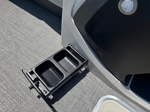 Slide: The Image of Built-in cup holders on the 2024 Barletta C24QC boat. - 9