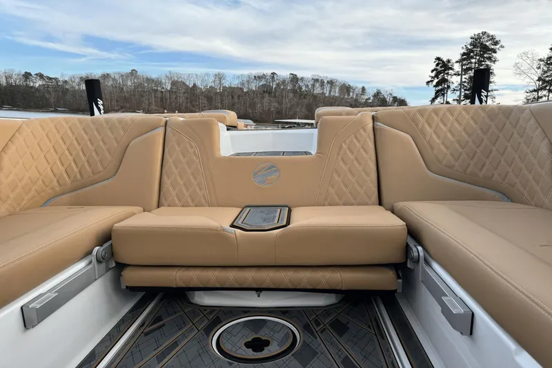 Slide: The Image of 2024 Tigé RZX22 boat interior with tan leather seating and diamond stitching. - 13