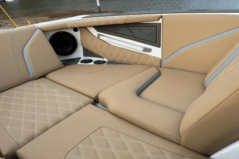 Slide: The Image of 2024 Tigé RZX22 boat interior with tan leather seats and diamond stitching. - 25