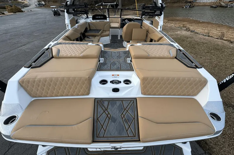 Slide: The Image of 2024 Tigé RZX22 boat interior with tan diamond-stitched seats and modern design. - 5