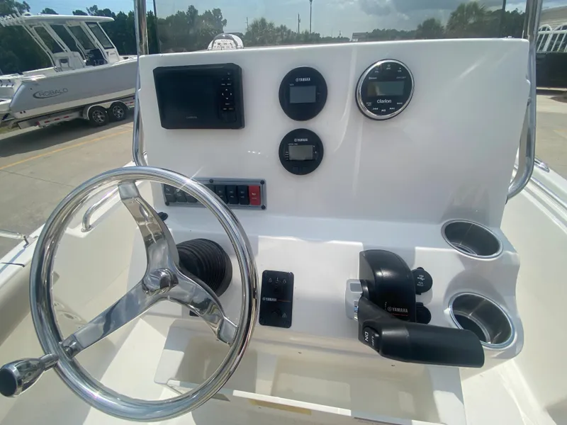 Slide: The Image of 2024 Key West 189 FS boat console with steering wheel and control panel. - 13