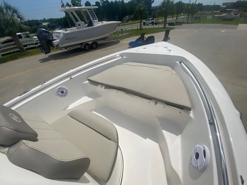 Slide: The Image of 2024 Key West 189 FS boat interior with cushioned seating and speakers. - 14