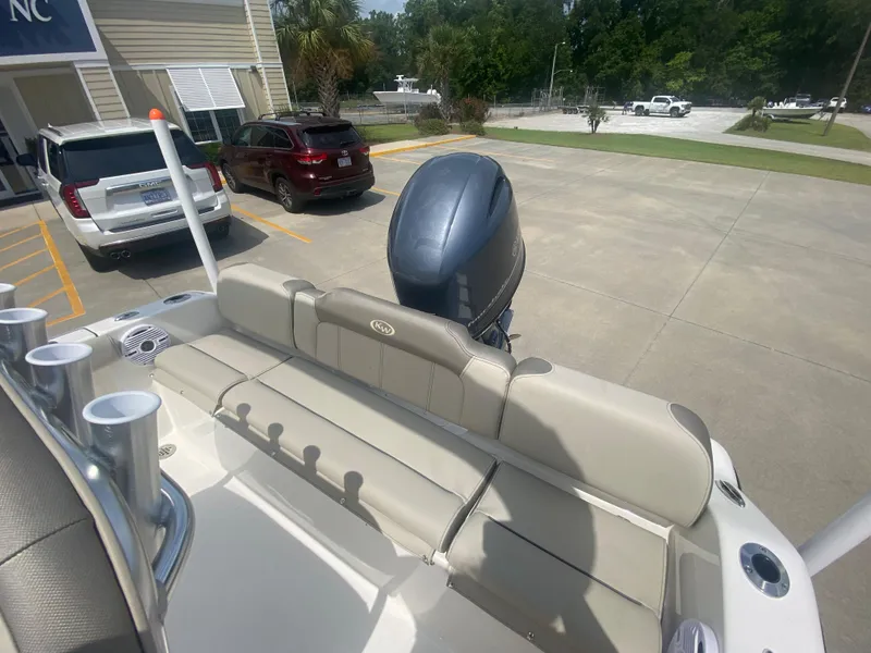 Slide: The Image of 2024 Key West 189 FS boat with outboard motor in parking lot. - 7
