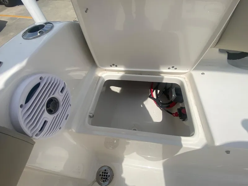 Slide: The Image of 2024 Key West 189 FS boat storage compartment with speaker and wiring. - 9