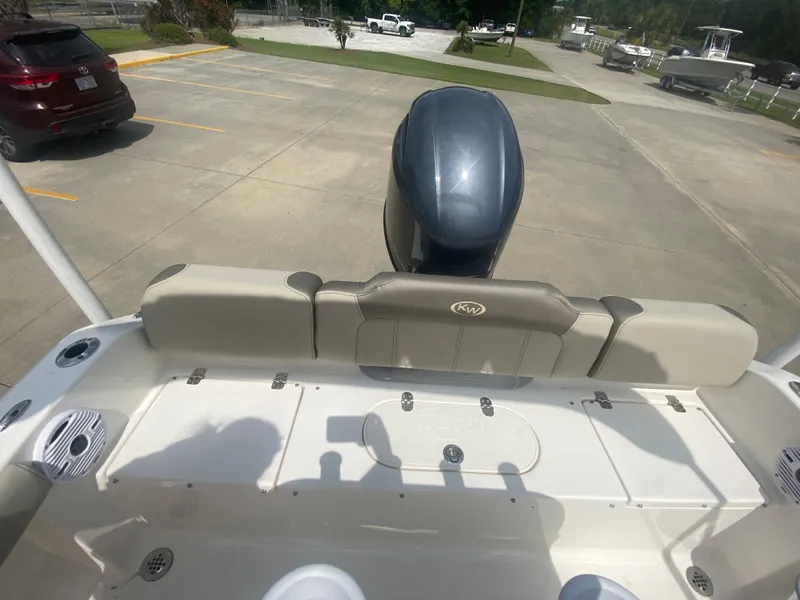 Slide: The Image of 2024 Key West 189 FS boat stern with outboard motor in parking lot. - 10