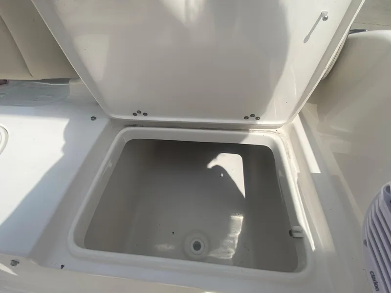 Slide: The Image of Open storage compartment on a 2024 Key West 189 FS boat. - 11