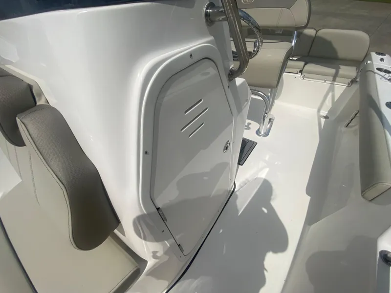 Slide: The Image of 2024 Key West 189 FS boat interior with steering console and seating. - 17