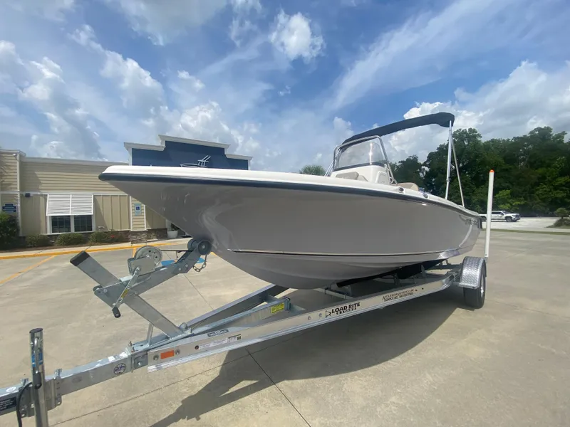 Slide: The Image of 2024 Key West 189 FS boat on a trailer under a blue sky. - 1