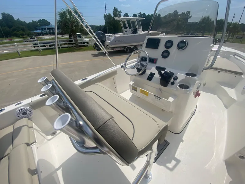 Slide: The Image of 2024 Key West 189 FS boat interior with steering console and seating. - 12