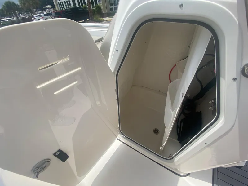 Slide: The Image of 2024 Key West 189 FS boat storage compartment with open hatch. - 19