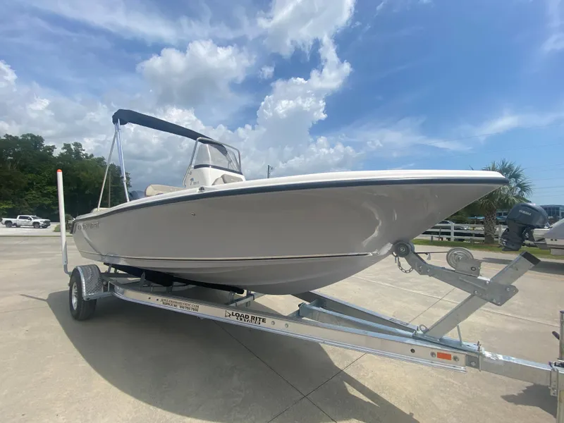 Slide: The Image of 2024 Key West 189 FS boat on trailer under blue sky. - 3