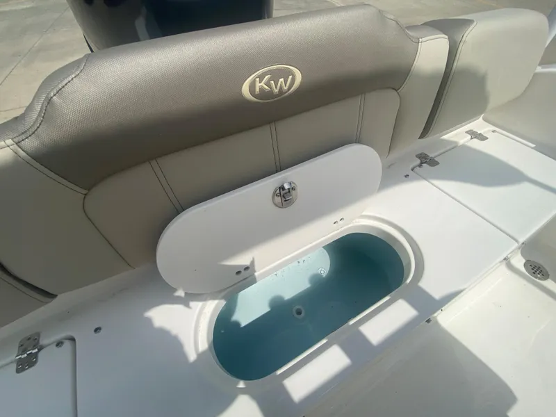 Slide: The Image of 2024 Key West 189 FS boat interior with livewell and cushioned seating. - 8