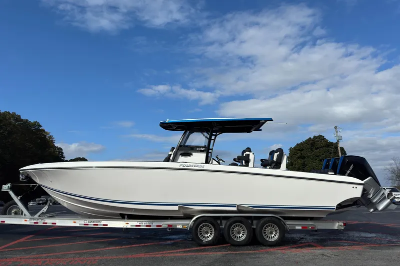 The Image of 2024 Fountain 34 SC boat on trailer under blue sky. - 0