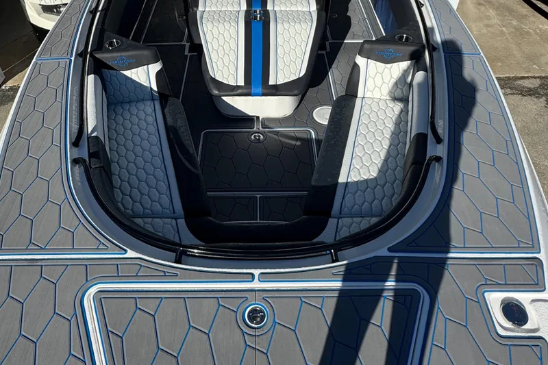 Slide: The Image of 2024 Fountain 34 SC boat interior with modern seating and hexagonal pattern design. - 10
