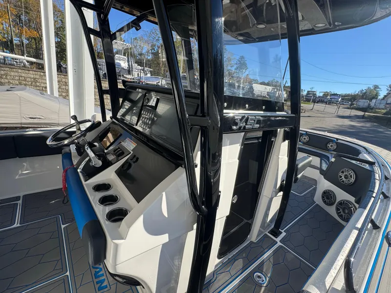Slide: The Image of 2024 Fountain 34 SC boat interior with modern dashboard and steering wheel. - 9
