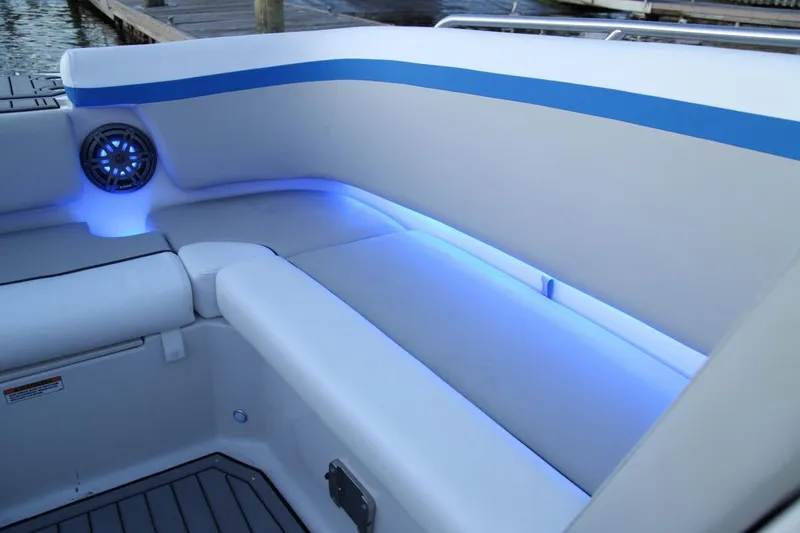 Slide: The Image of 2024 Starcraft SVX 231 OB DH boat interior with blue LED lighting. - 7