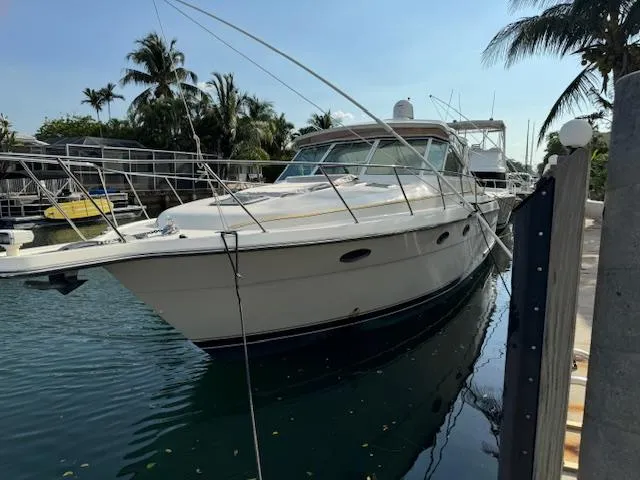 Slide: The Image of 1996 Tiara Yachts 3500 Express docked in a tropical marina. - 28