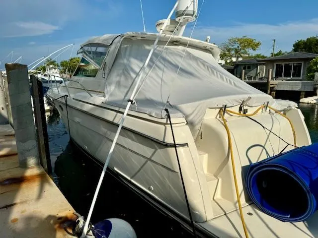 Slide: The Image of 1996 Tiara Yachts 3500 Express docked at a marina. - 9