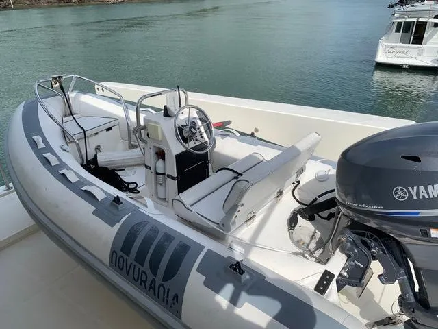 Slide: The Image of 2008 Hampton Command Bridge with Novurania tender and Yamaha outboard motor. - 11