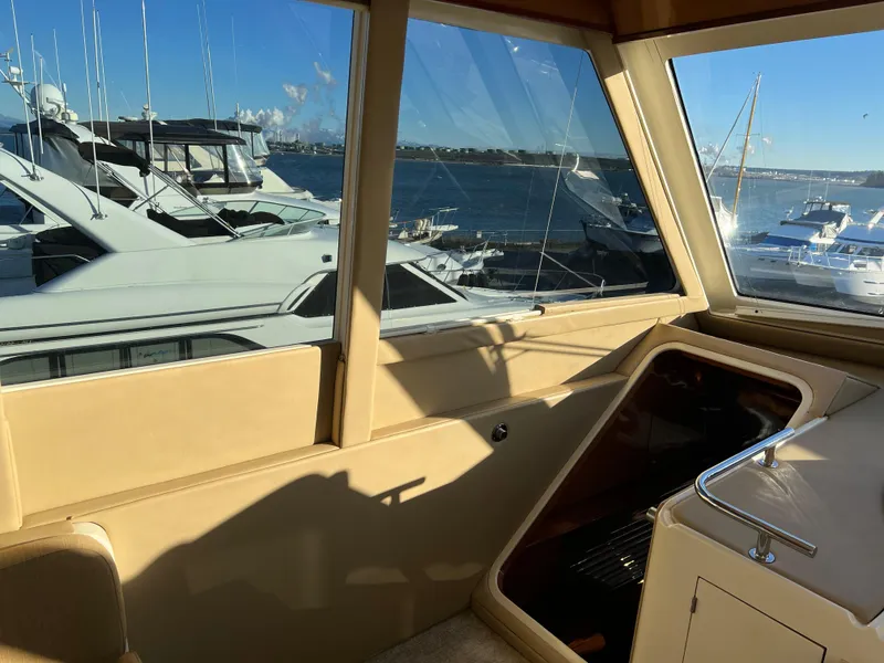 Slide: The Image of Interior view of 2008 Hampton Command Bridge yacht with marina background. - 25