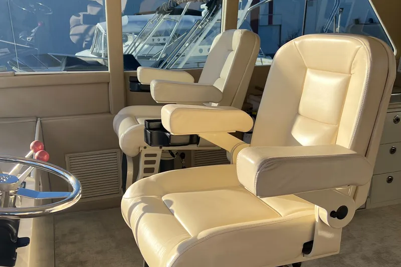 Slide: The Image of Luxurious captain's chairs on a 2008 Hampton Command Bridge yacht. - 29