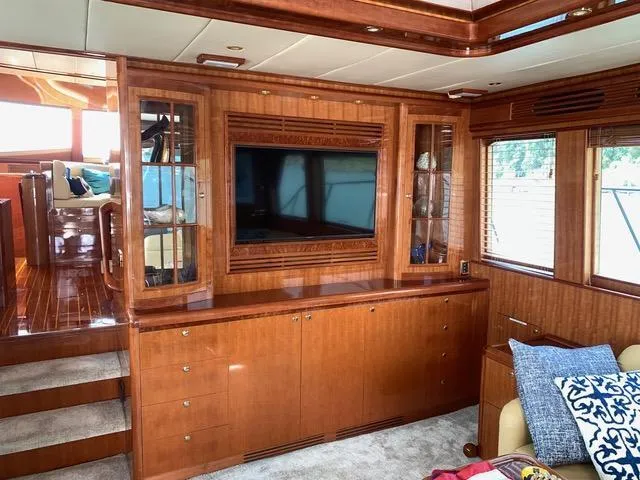 Slide: The Image of Luxurious interior of a 2008 Hampton Command Bridge yacht with wood paneling and built-in TV. - 3