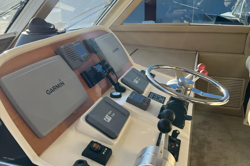 Slide: The Image of 2008 Hampton Command Bridge helm with Garmin navigation system and steering wheel. - 31