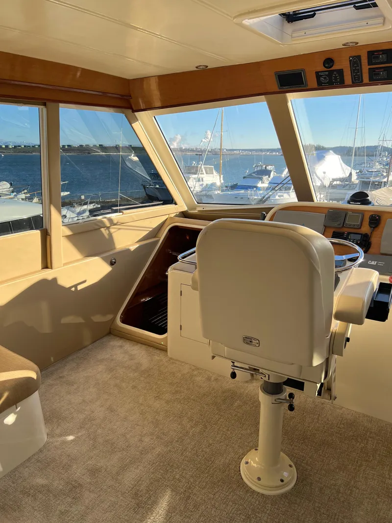 Slide: The Image of Interior of 2008 Hampton Command Bridge yacht with helm station and panoramic windows. - 33