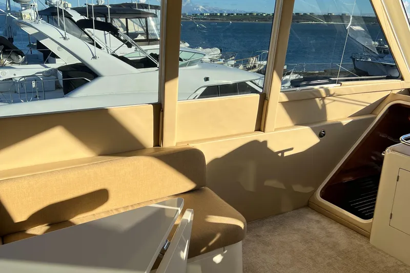 Slide: The Image of Interior of a 2008 Hampton Command Bridge yacht with marina view. - 36