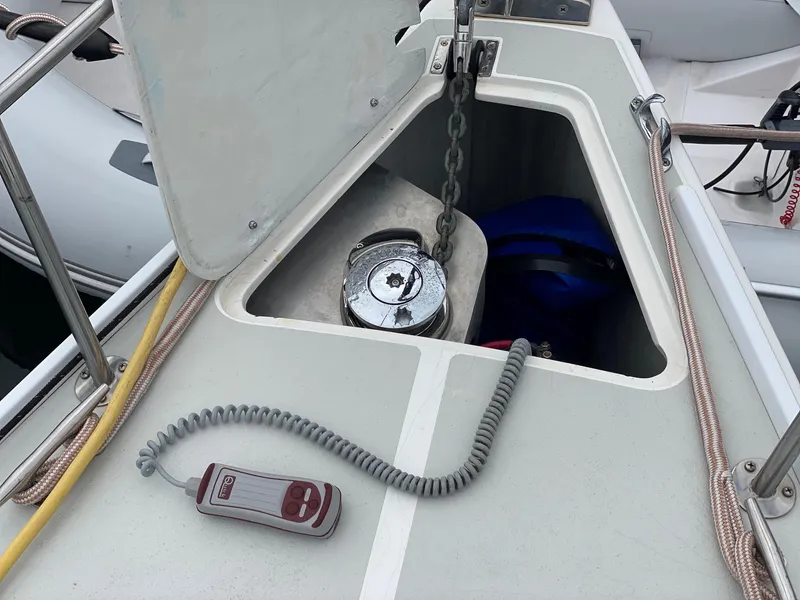 Slide: The Image of Anchor locker of a 2001 J Boats 32 sailboat with chain and remote control. - 10
