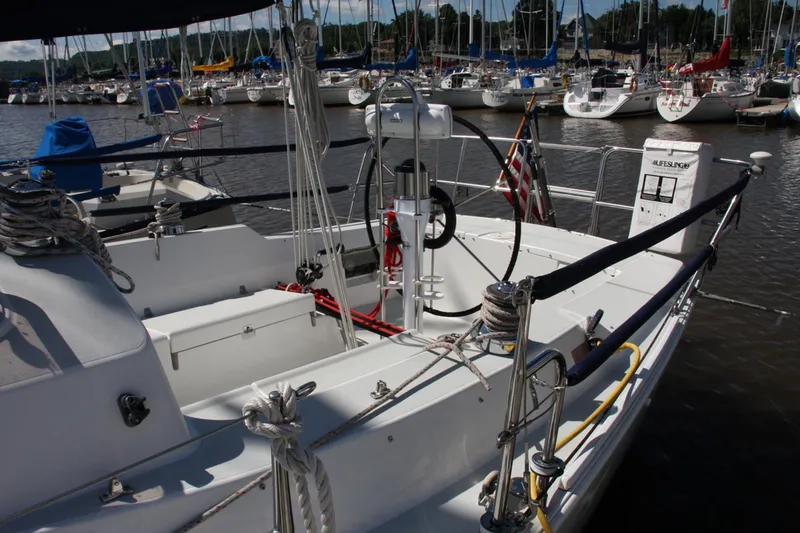 Slide: The Image of Sailboat docked in marina, J Boats 32, 2001 model, with rigging and ropes visible. - 23