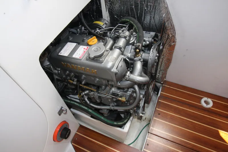 Slide: The Image of Engine compartment of a 2001 J Boats 32, featuring a Yanmar marine engine. - 35