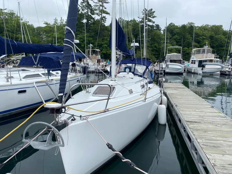 Slide: The Image of Sailboat docked in marina, 2001 J Boats 32, surrounded by other vessels. - 5