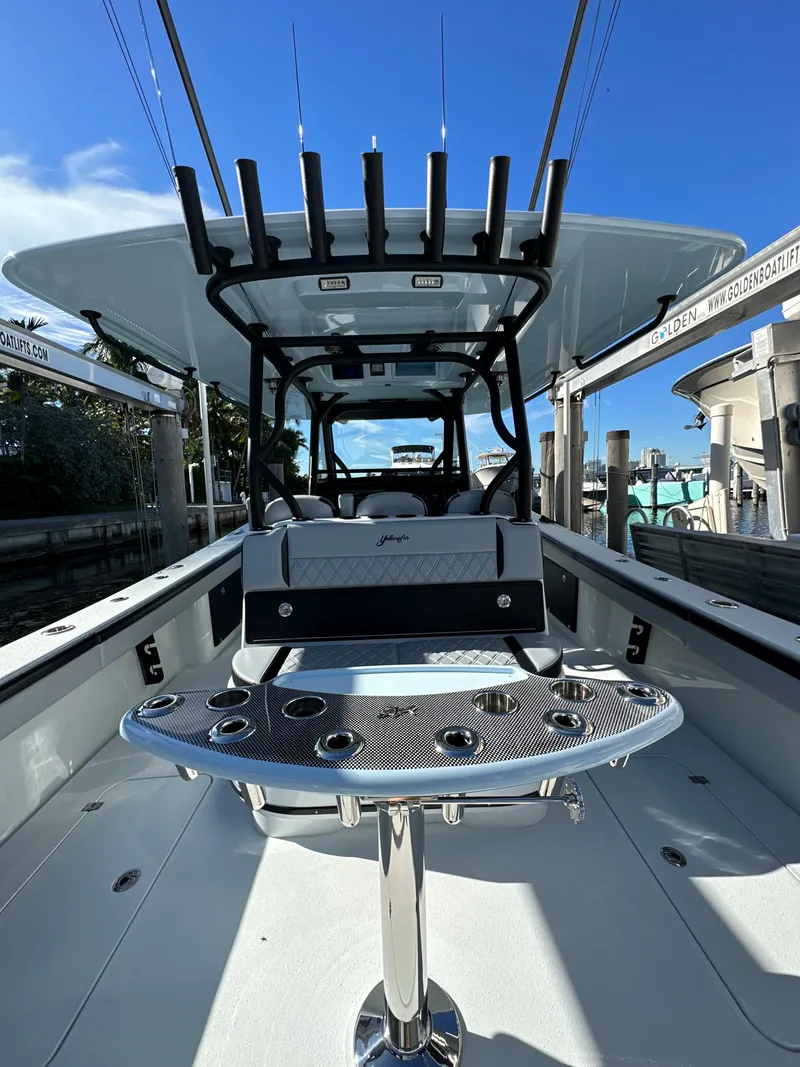 Slide: The Image of 2022 Yellowfin 39 boat with fishing rod holders and center console. - 10