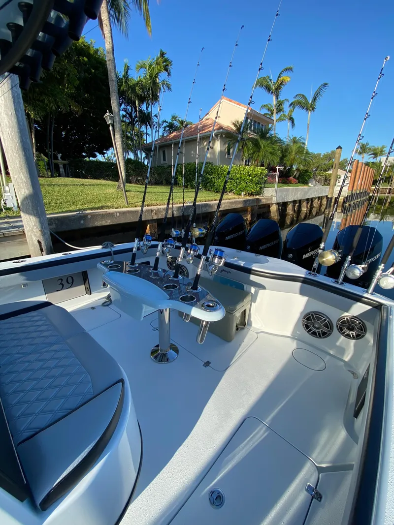 Slide: The Image of 2022 Yellowfin 39 boat with fishing rods and luxurious seating. - 12