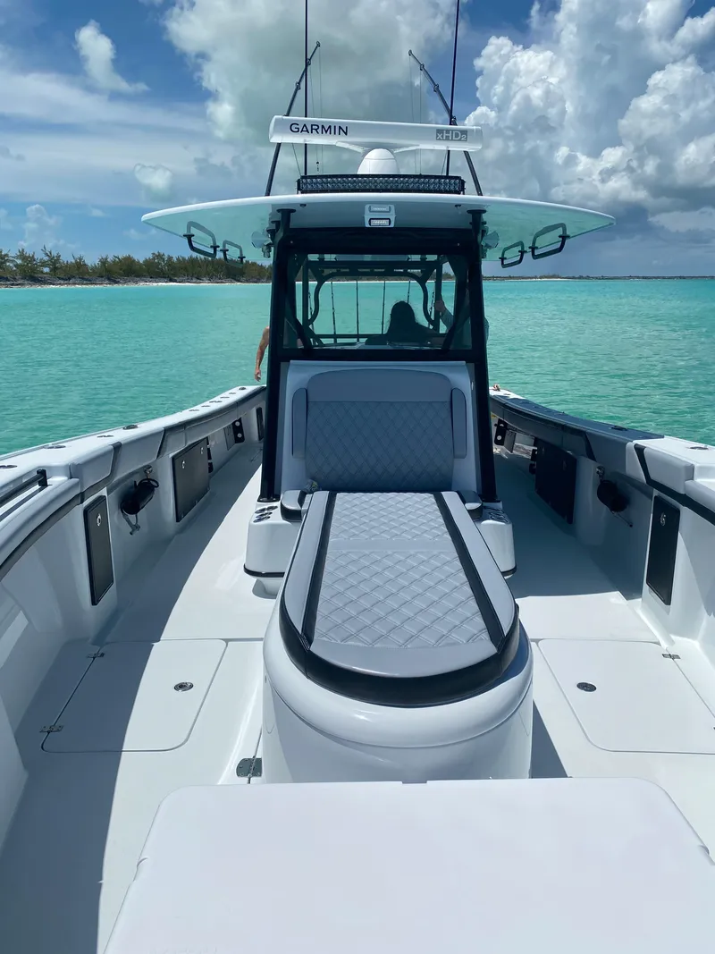 Slide: The Image of 2022 Yellowfin 39 boat on turquoise water with Garmin equipment. - 13